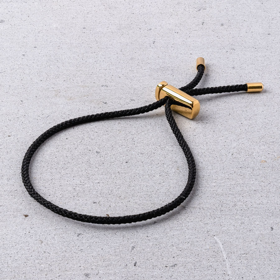 Our Black & Gold Drawstring Bracelet has been crafted using the finest braided maritime grade nylon rope.